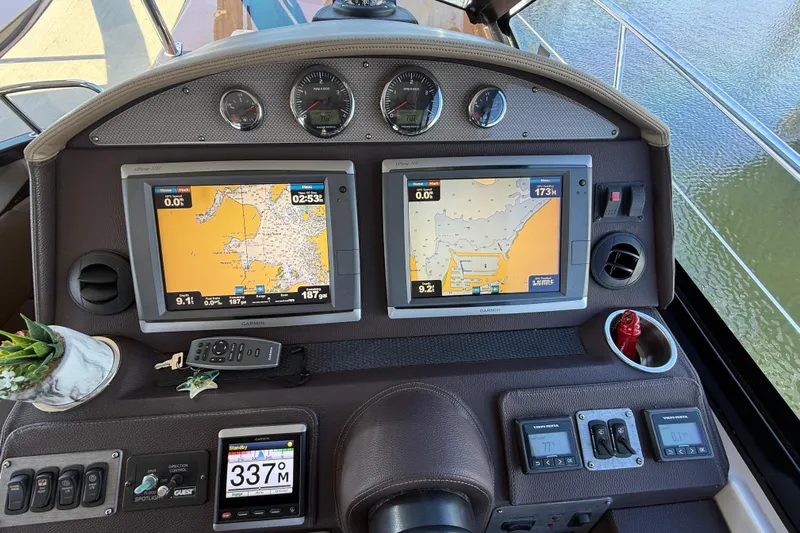  Yacht Photos Pics Dashboard of a 2015 Regal 46 Sport Coupe with navigation screens and controls.
