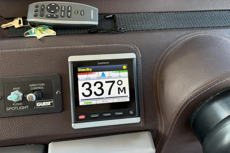  Yacht Photos Pics Garmin navigation display on 2015 Regal 46 Sport Coupe dashboard with remote and keys.