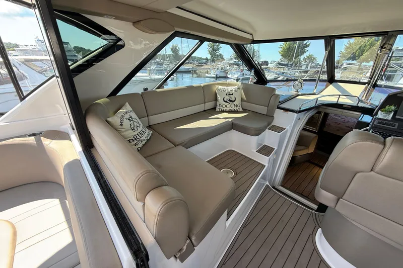  Yacht Photos Pics Luxurious interior of 2015 Regal 46 Sport Coupe yacht with plush seating and scenic views.