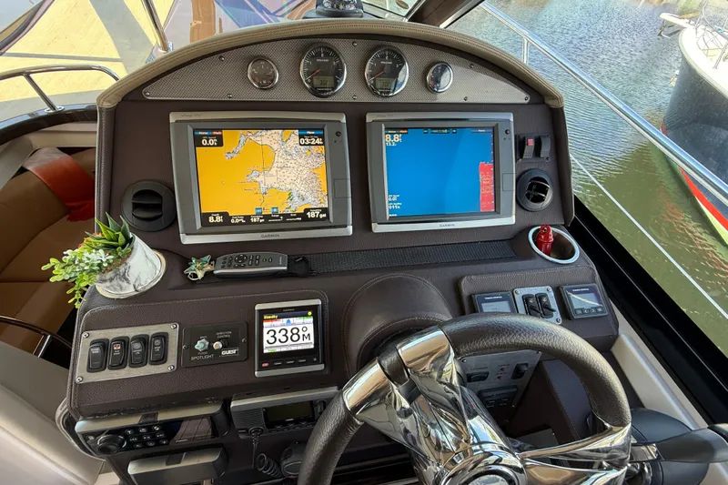  Yacht Photos Pics 2015 Regal 46 Sport Coupe helm with navigation screens and controls.