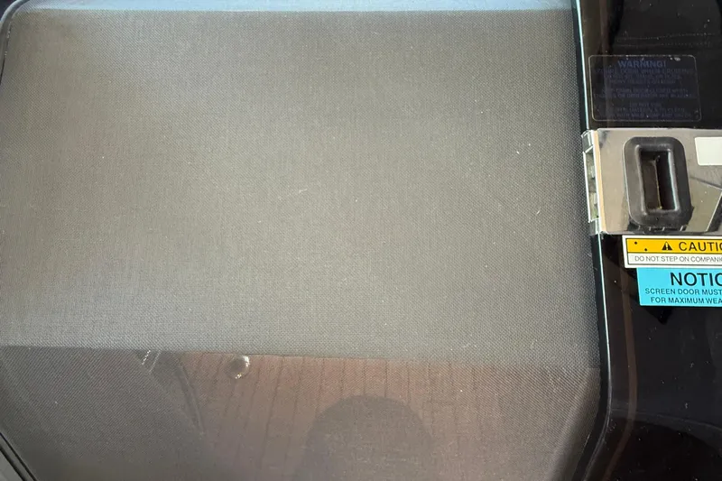  Yacht Photos Pics Screen door with caution and notice labels on a 2015 Regal 46 Sport Coupe.