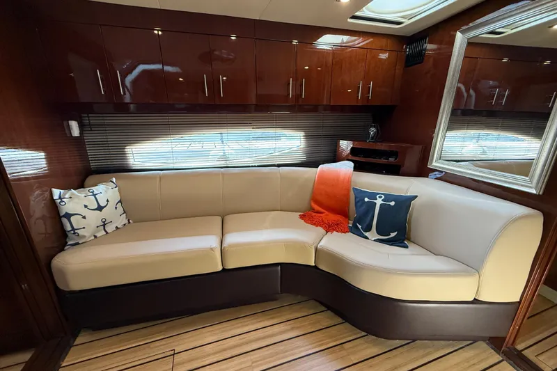  Yacht Photos Pics Luxurious interior of 2015 Regal 46 Sport Coupe with elegant seating and nautical decor.