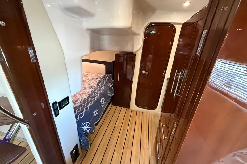  Yacht Photos Pics 2015 Regal 46 Sport Coupe interior with wood finish and cozy bed.