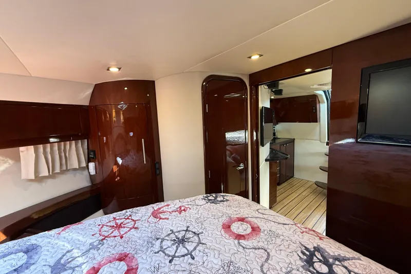  Yacht Photos Pics Luxurious interior of 2015 Regal 46 Sport Coupe yacht with wood finishes and modern amenities.