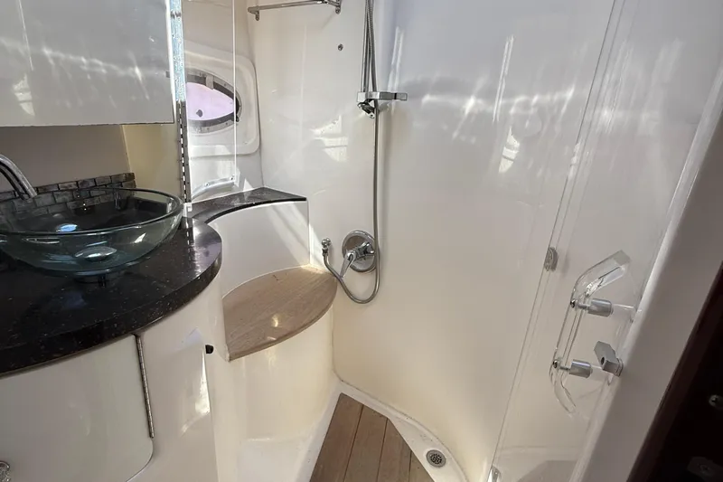  Yacht Photos Pics Luxurious bathroom in 2015 Regal 46 Sport Coupe yacht with glass sink and shower.