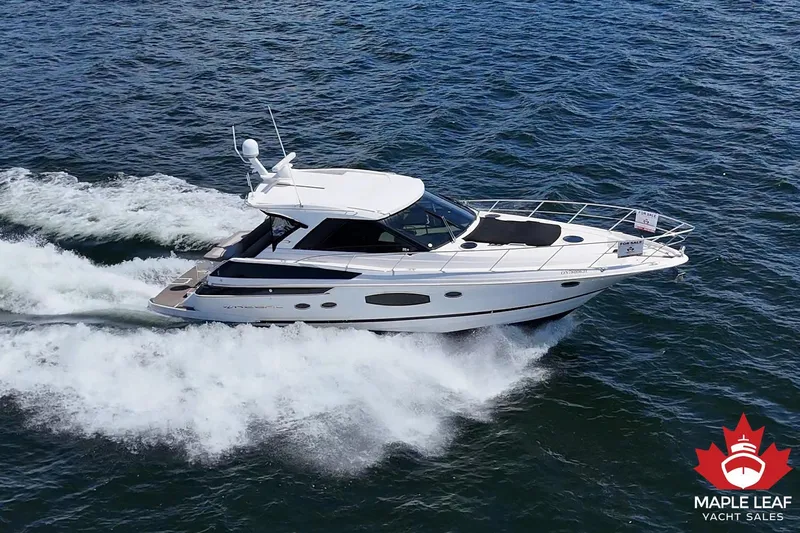  Yacht Photos Pics 2015 Regal 46 Sport Coupe yacht cruising on open water, listed for sale by Maple Leaf Yacht Sales.