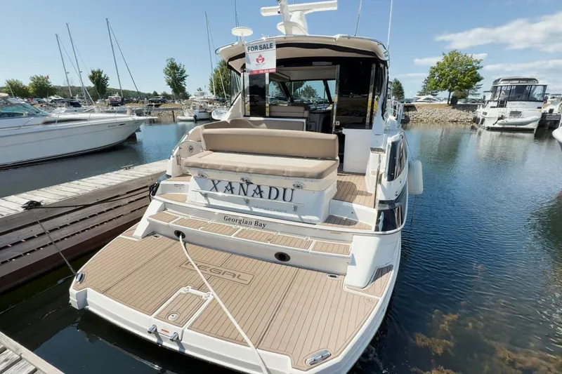  Yacht Photos Pics 2015 Regal 46 Sport Coupe yacht docked, for sale at marina.