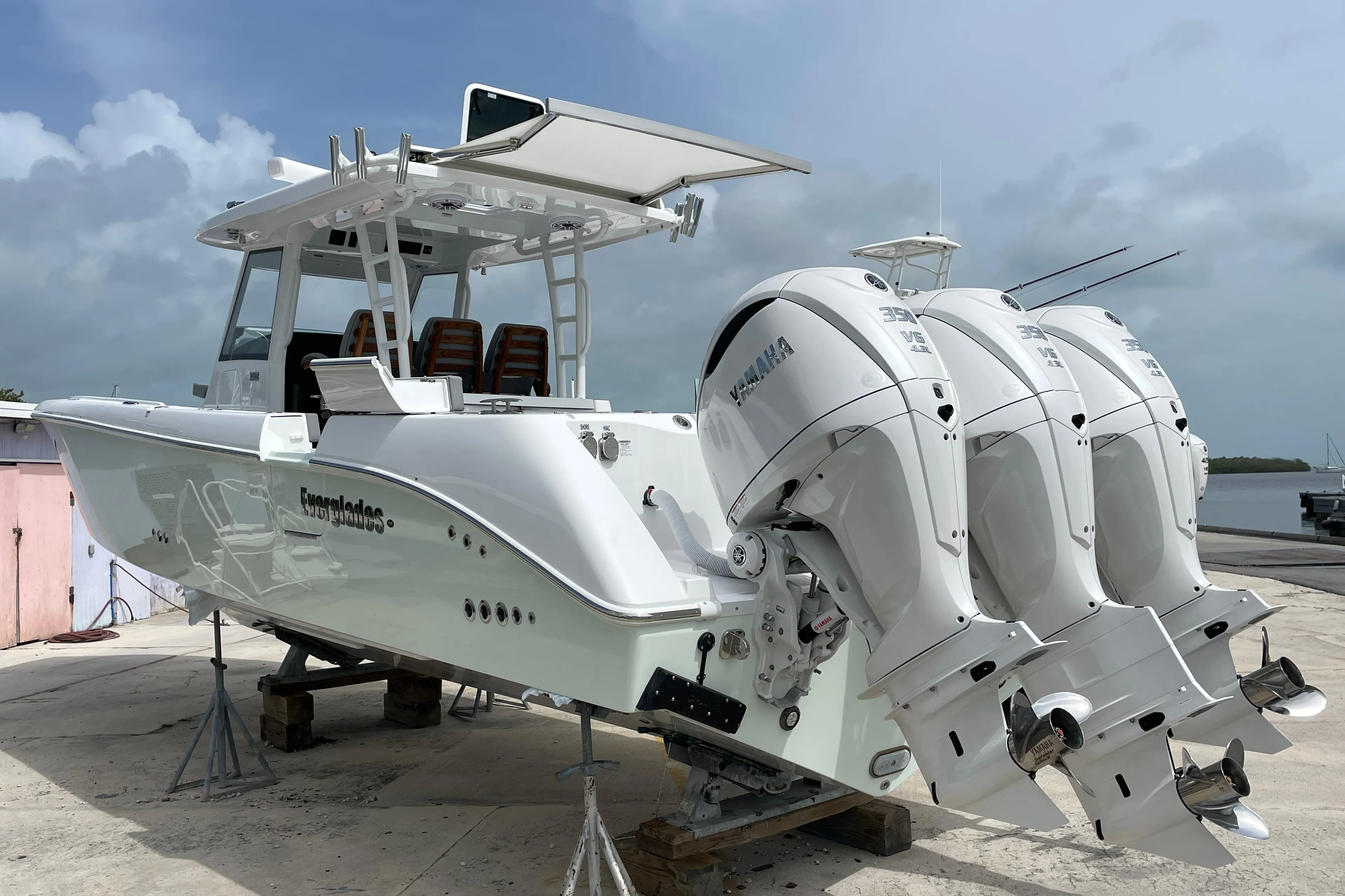 2026 Everglades 375cc boat with triple Yamaha outboard engines on a dock.