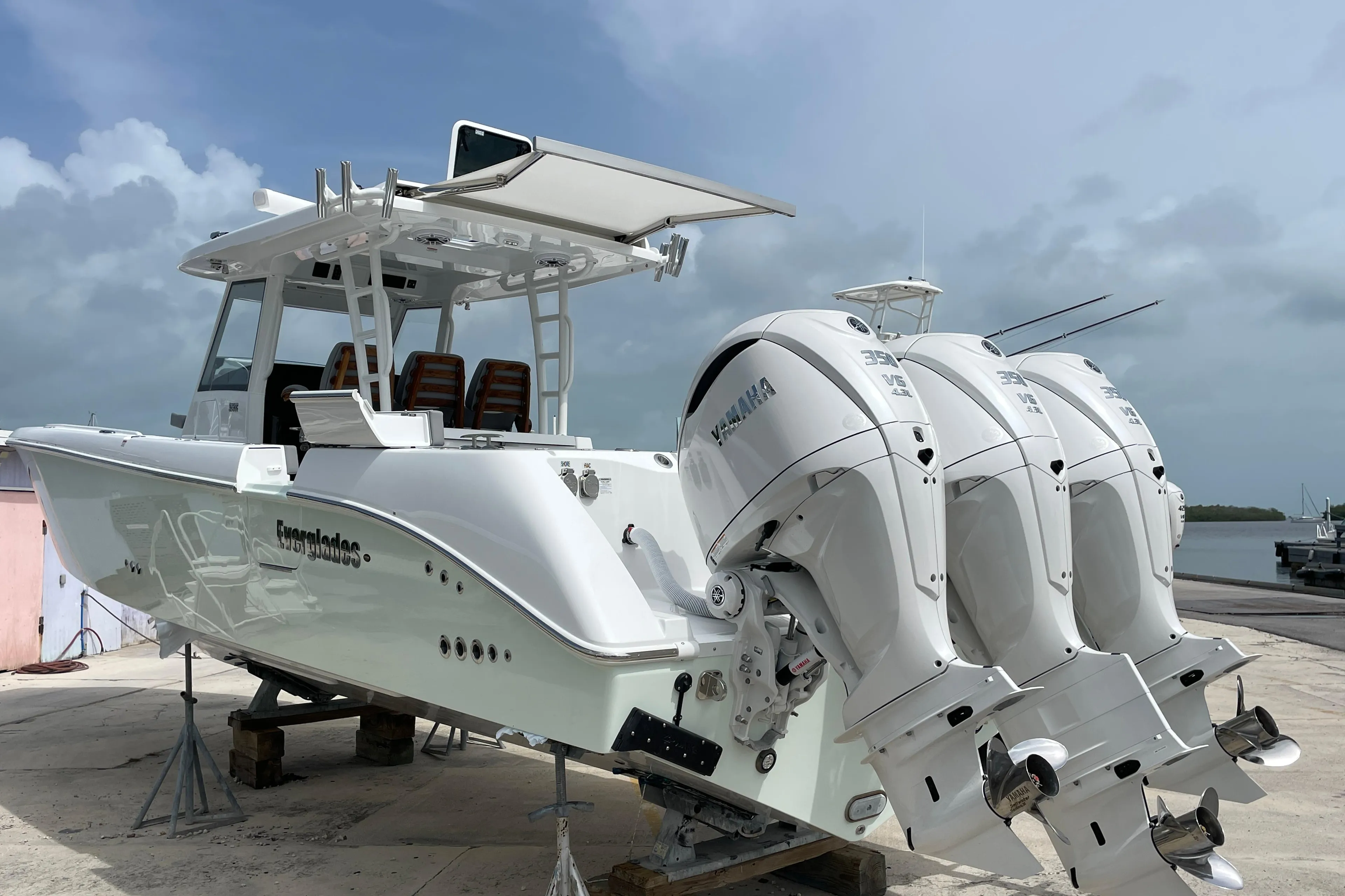 2026 Everglades 375cc boat with triple Yamaha outboard engines on a dock.