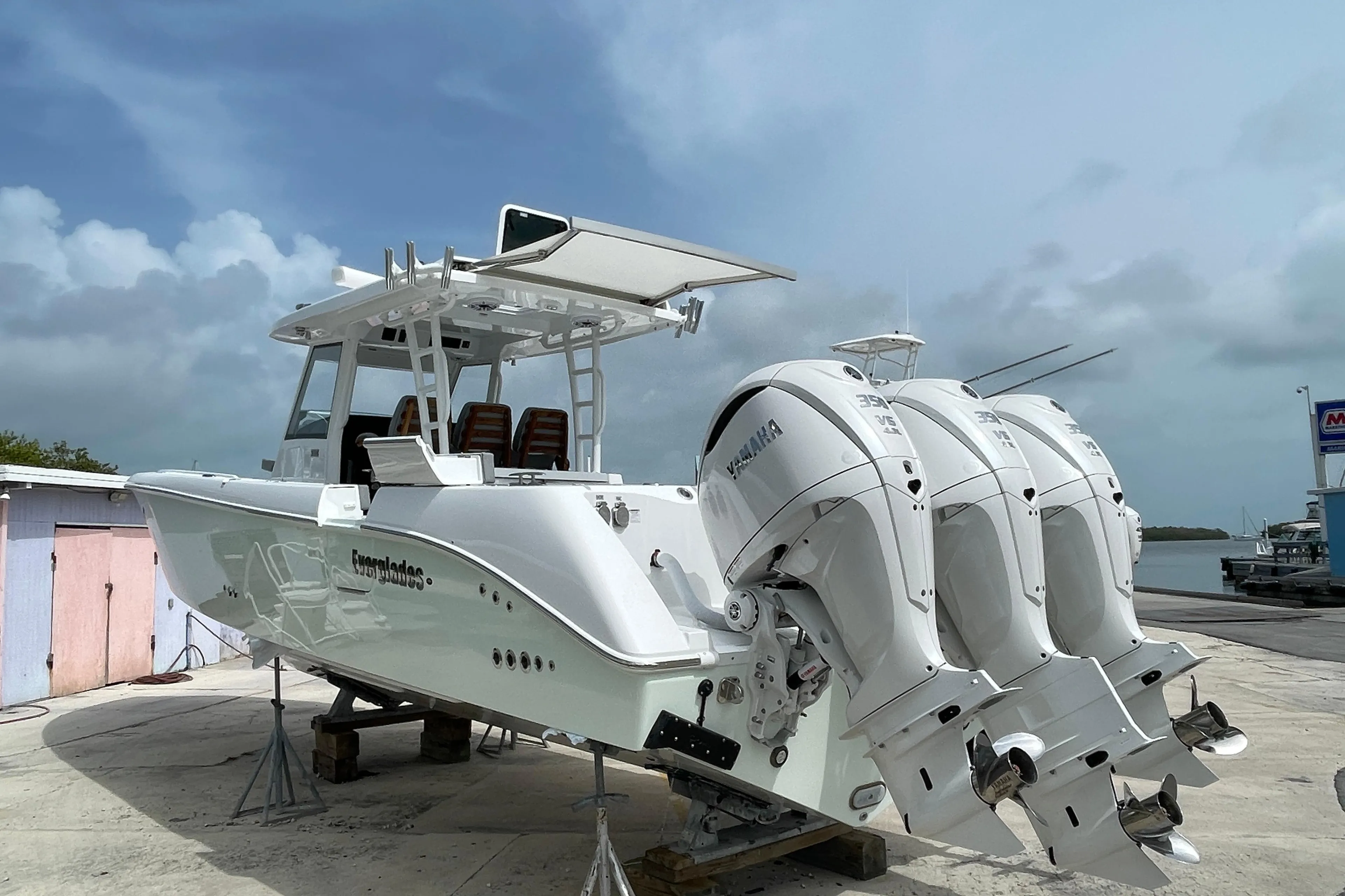 2026 Everglades 375cc boat with triple Yamaha engines on a dock.