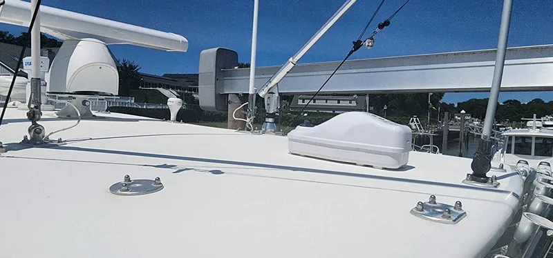  Yacht Photos Pics 2013 SeaVee 32 boat deck with radar and antennas under clear blue sky.