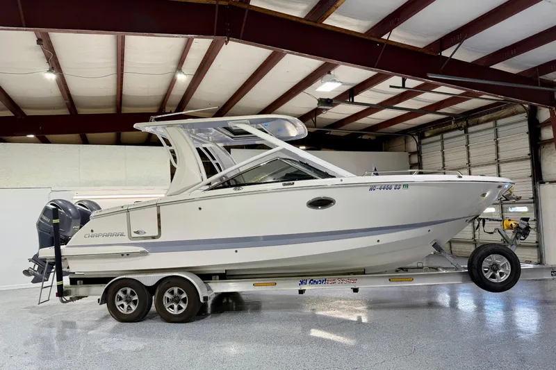  Yacht Photos Pics 2021 Chaparral 280 OSX boat on trailer in indoor storage facility.