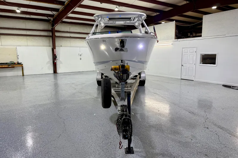  Yacht Photos Pics 2021 Chaparral 280 OSX boat on trailer in spacious indoor garage.