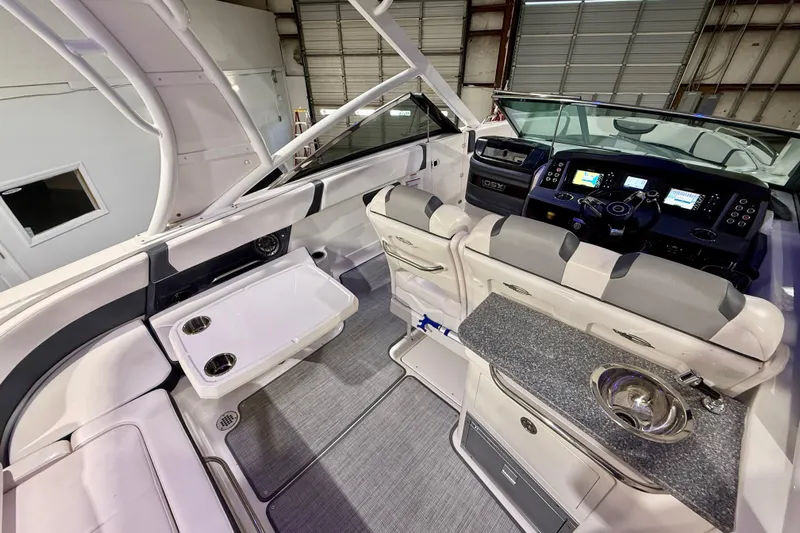 Yacht Photos Pics 2021 Chaparral 280 OSX boat interior with modern dashboard, seating, and amenities.