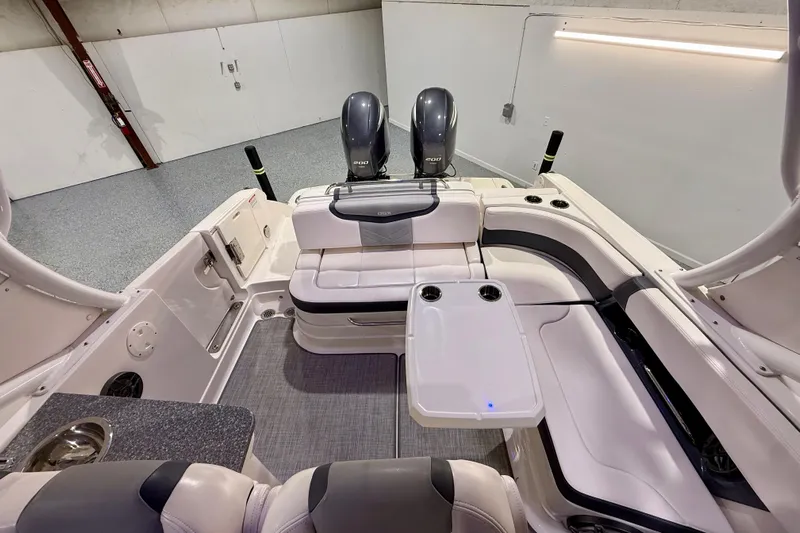  Yacht Photos Pics 2021 Chaparral 280 OSX boat interior with seating and dual outboard engines.