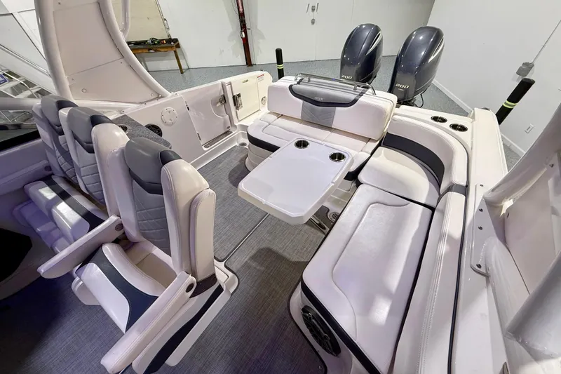  Yacht Photos Pics 2021 Chaparral 280 OSX boat interior with seating and dual outboard engines.
