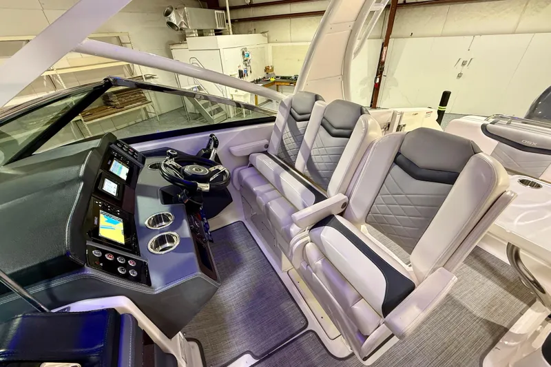  Yacht Photos Pics 2021 Chaparral 280 OSX boat interior with modern helm and luxurious seating.