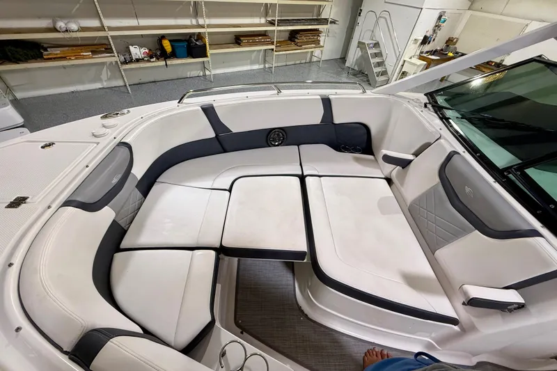  Yacht Photos Pics Luxurious seating area on a 2021 Chaparral 280 OSX boat, featuring elegant white upholstery.