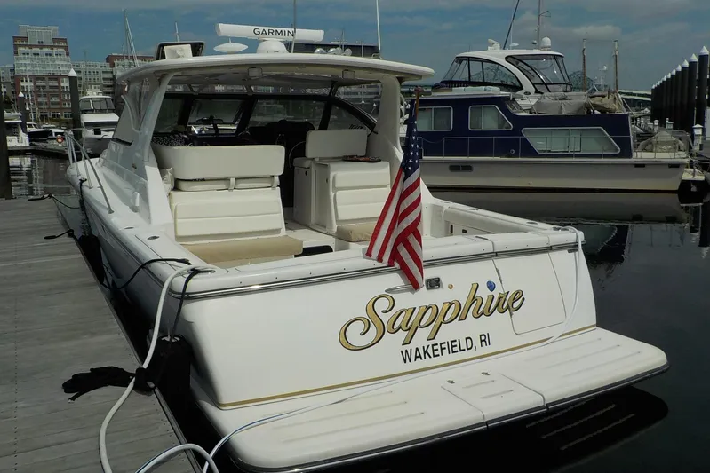 "sapphire" Yacht Photos Pics 2001 Tiara Yachts 3800 Open docked, featuring "Sapphire" from Wakefield, RI, with American flag.