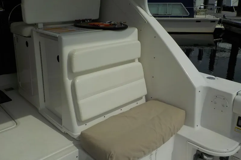 "sapphire" Yacht Photos Pics 2001 Tiara Yachts 3800 Open interior seating area with cushioned bench and storage.