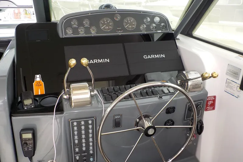 "sapphire" Yacht Photos Pics 2001 Tiara Yachts 3800 Open helm with Garmin navigation and control panel.
