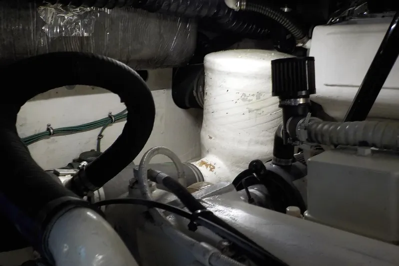 "sapphire" Yacht Photos Pics Engine room of a 2001 Tiara Yachts 3800 Open, showcasing mechanical components and hoses.