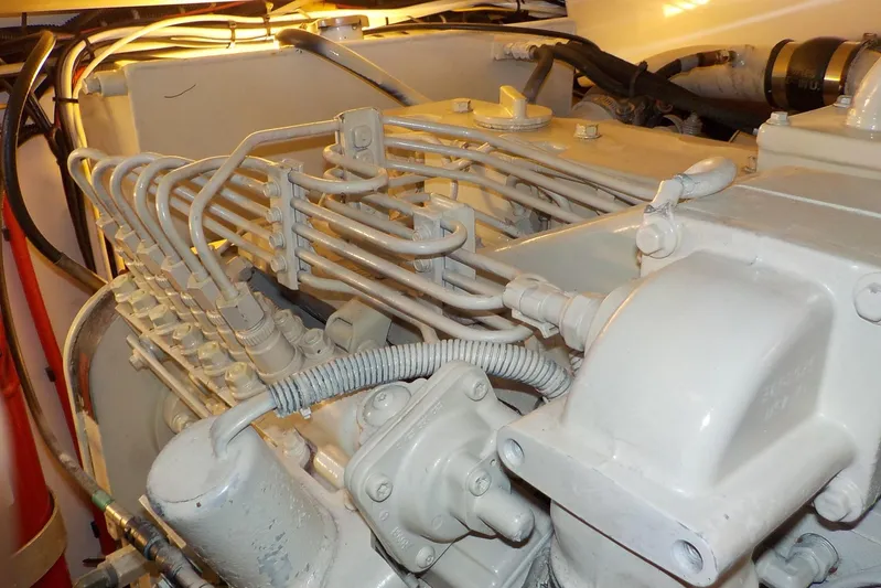 "sapphire" Yacht Photos Pics Engine components of a 2001 Tiara Yachts 3800 Open, showcasing intricate piping and connections.