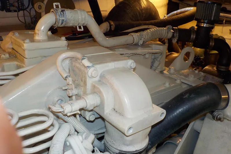 "sapphire" Yacht Photos Pics Engine compartment of a 2001 Tiara Yachts 3800 Open, showcasing mechanical components and hoses.