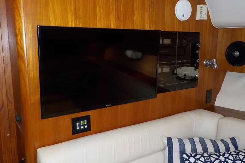 "sapphire" Yacht Photos Pics Interior of 2001 Tiara Yachts 3800 Open with TV and control panel.