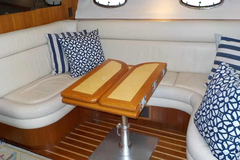 "sapphire" Yacht Photos Pics Luxurious interior of 2001 Tiara Yachts 3800 Open with elegant seating and decorative pillows.