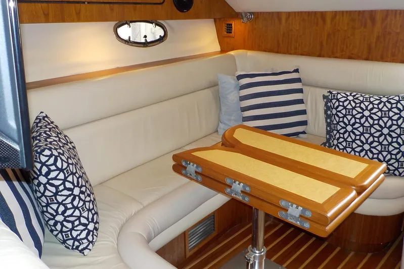 "sapphire" Yacht Photos Pics Luxurious interior of 2001 Tiara Yachts 3800 Open with elegant seating and decorative pillows.