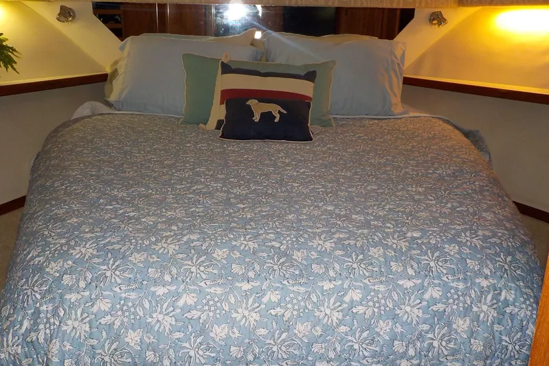 "sapphire" Yacht Photos Pics Cozy bedroom with floral bedding in 2001 Tiara Yachts 3800 Open.