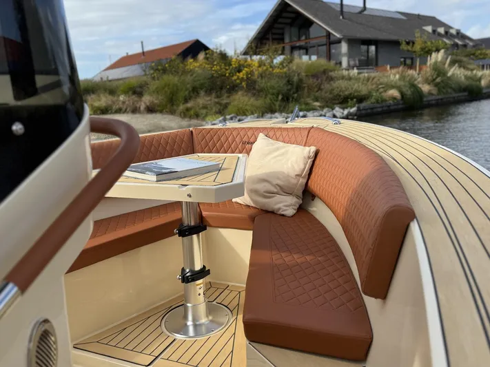  Yacht Photos Pics Luxurious AlCustom Levanzo 25 boat interior with leather seating and table, 2025 model.