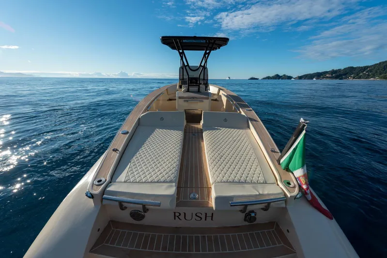  Yacht Photos Pics AlCustom Levanzo 25 boat on open sea, 2025 model, with Italian flag and clear sky.