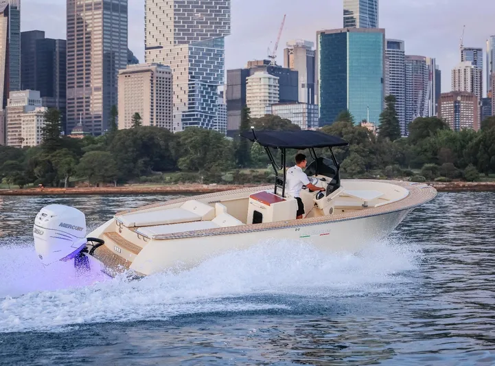  Yacht Photos Pics AlCustom Levanzo 25 boat cruising near city skyline, 2025 model.