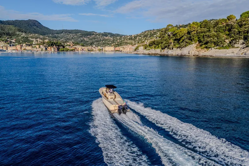  Yacht Photos Pics AlCustom Levanzo 25 boat cruising on scenic blue waters, 2025 model.