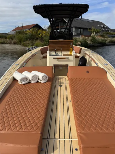  Yacht Photos Pics Luxurious AlCustom Levanzo 25 boat, 2025 model, with plush seating and scenic background.