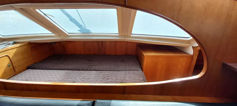 Zarafet Yacht Photos Pics 1995 Prout 45 interior cabin with wooden finish and large windows.