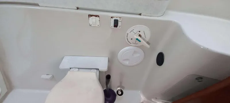 Zarafet Yacht Photos Pics 1995 Prout 45 yacht bathroom with toilet and control panel.