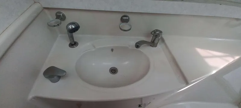 Zarafet Yacht Photos Pics Bathroom sink with chrome fixtures in a 1995 Prout 45 yacht.