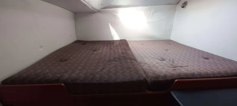 Zarafet Yacht Photos Pics Interior cabin of a 1995 Prout 45 catamaran with a double bed.