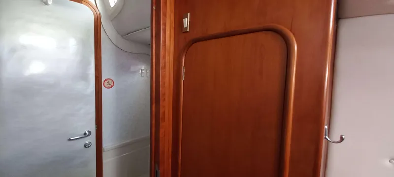 Zarafet Yacht Photos Pics Interior of a 1995 Prout 45 yacht, featuring wooden doors and sleek design elements.