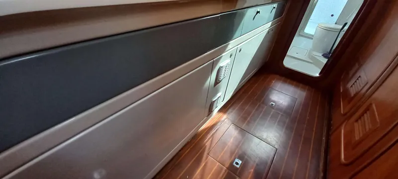 Zarafet Yacht Photos Pics Interior of 1995 Prout 45 yacht with wooden flooring and modern cabinetry.