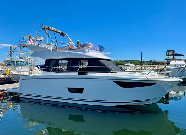 Portkey Yacht Photos Pics 2016 Jeanneau Velasco 37F yacht docked in a sunny marina.
