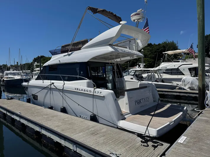 Portkey Yacht Photos Pics 2016 Jeanneau Velasco 37F yacht docked at marina under clear blue sky.