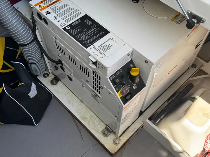 Portkey Yacht Photos Pics Engine compartment of a 2016 Jeanneau Velasco 37F with Cummins Onan generator.