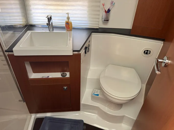 Portkey Yacht Photos Pics Bathroom interior of 2016 Jeanneau Velasco 37F yacht with sink and toilet.