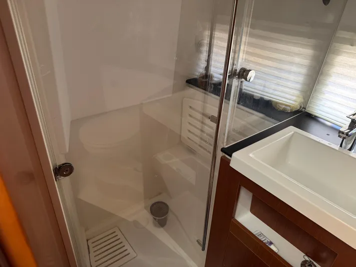 Portkey Yacht Photos Pics Bathroom interior of 2016 Jeanneau Velasco 37F yacht with shower and sink.