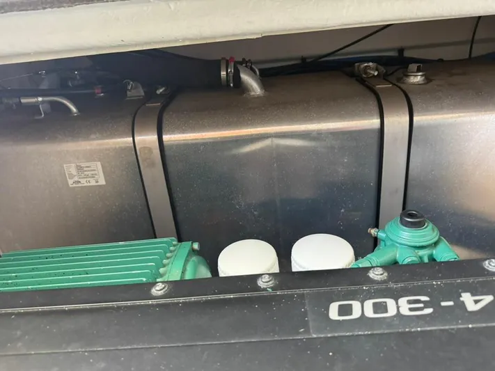 Portkey Yacht Photos Pics Engine compartment of a 2016 Jeanneau Velasco 37F boat, showcasing mechanical components.