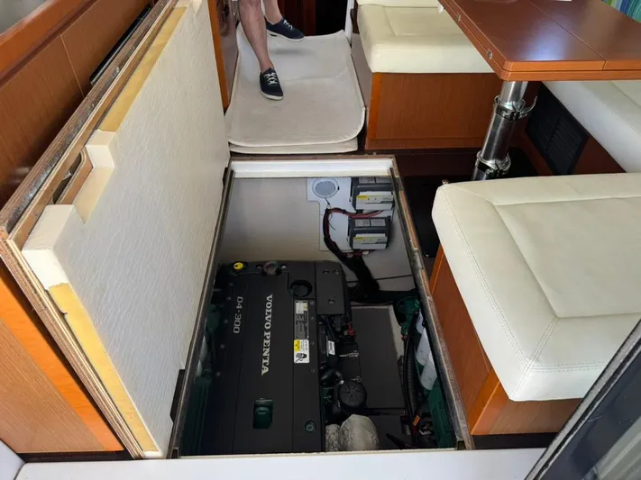 Portkey Yacht Photos Pics Engine compartment of 2016 Jeanneau Velasco 37F with Volvo Penta engine, under cabin seating.